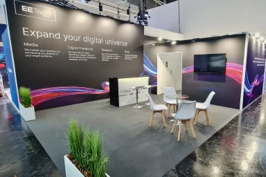 Trade fair stand with overhead signage and lighting